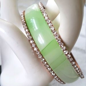 Jade bracelet and copper rhinstone bracelets.